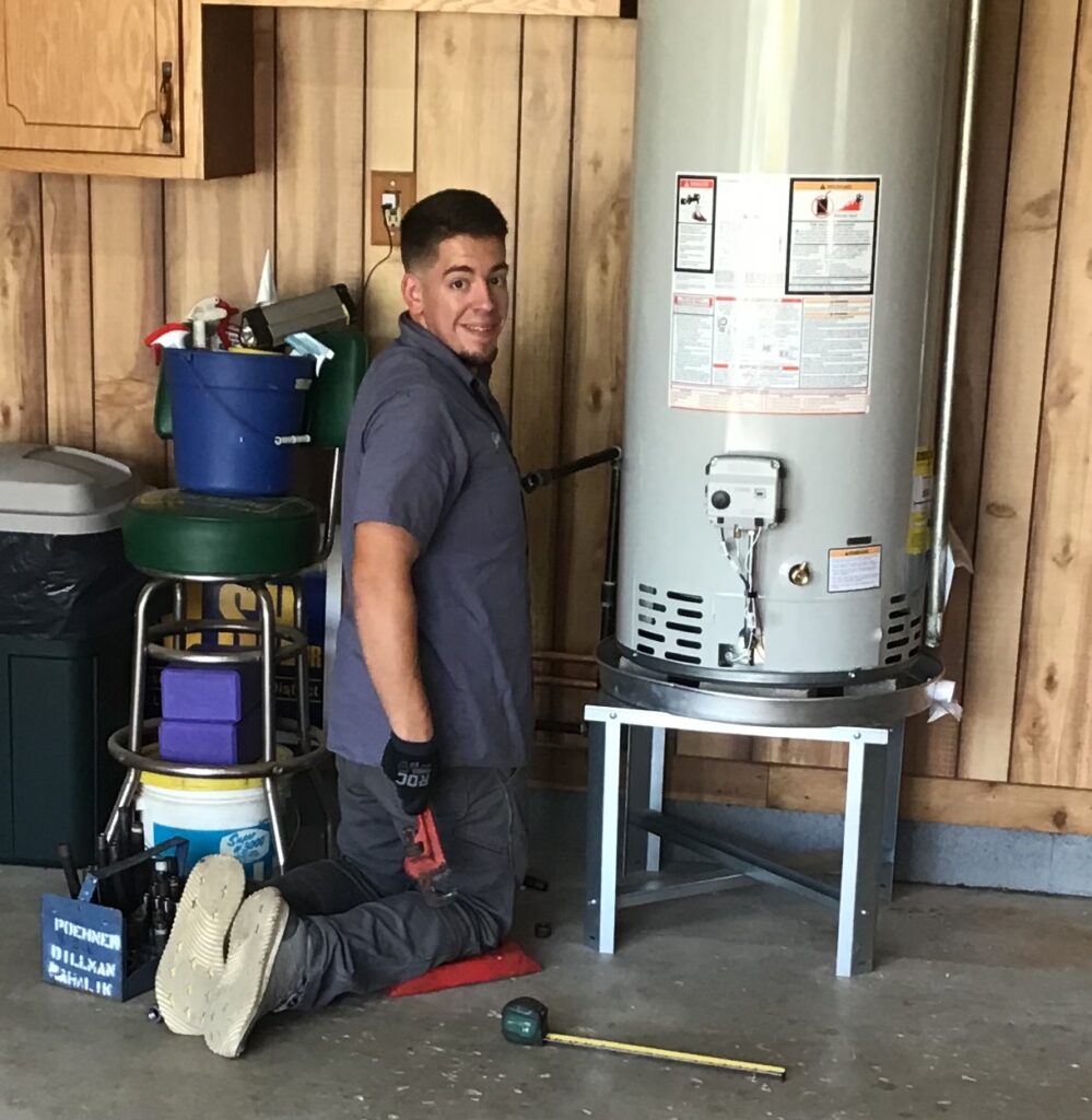 PDM plumber repairing a water heater