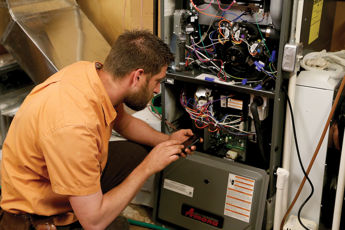 Technician Calibrating Furnace